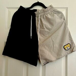 Black and beige shorts with bear logo